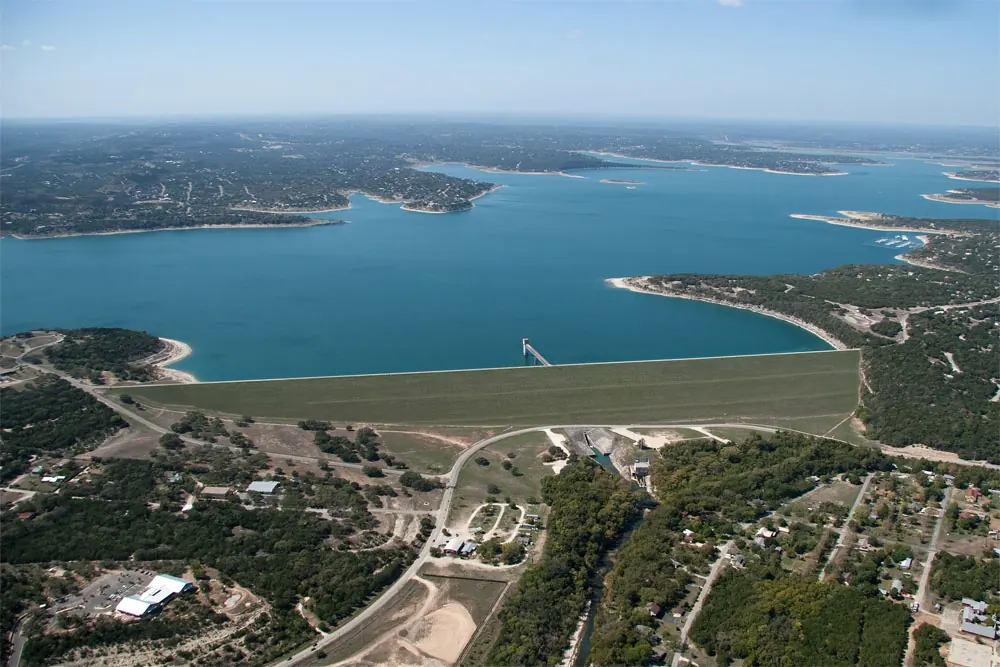 Clear blue water and wooded shoreline at Canyon Lake, Texas